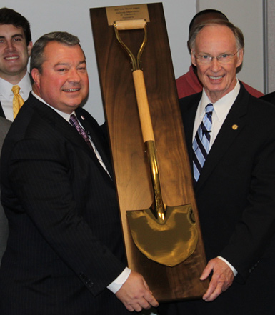 Alabama Secretary of Commerce Greg Canfield (left) and Governor Robert Bentley (right) pose with the state’s Gold Shovel in the 3+ to 5 million population category.