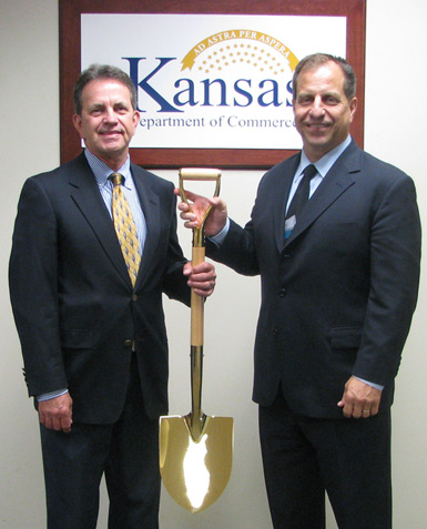 Kansas Commerce Secretary Pat George (right) and Deputy Secretary of Business and Community Development Steve Kelly (left) hold the state’s Gold Shovel in the under 3 million population category.