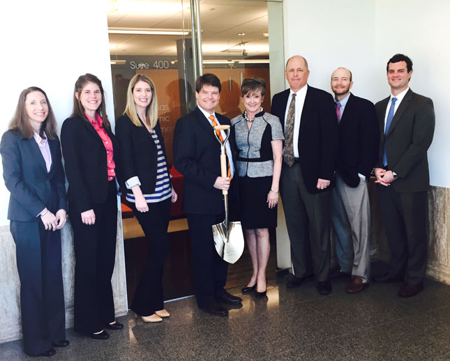 Figure 1: Arkansas Economic Development Commission Executive Director Grant Tennille holds the Silver Shovel award. He’s joined by Bentley Story (far right), director of Business Development, and other BD team members.
