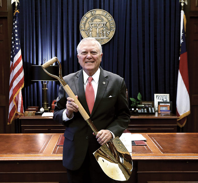 Figure 6: Georgia Governor Nathan Deal holds the state’s Gold Shovel award.